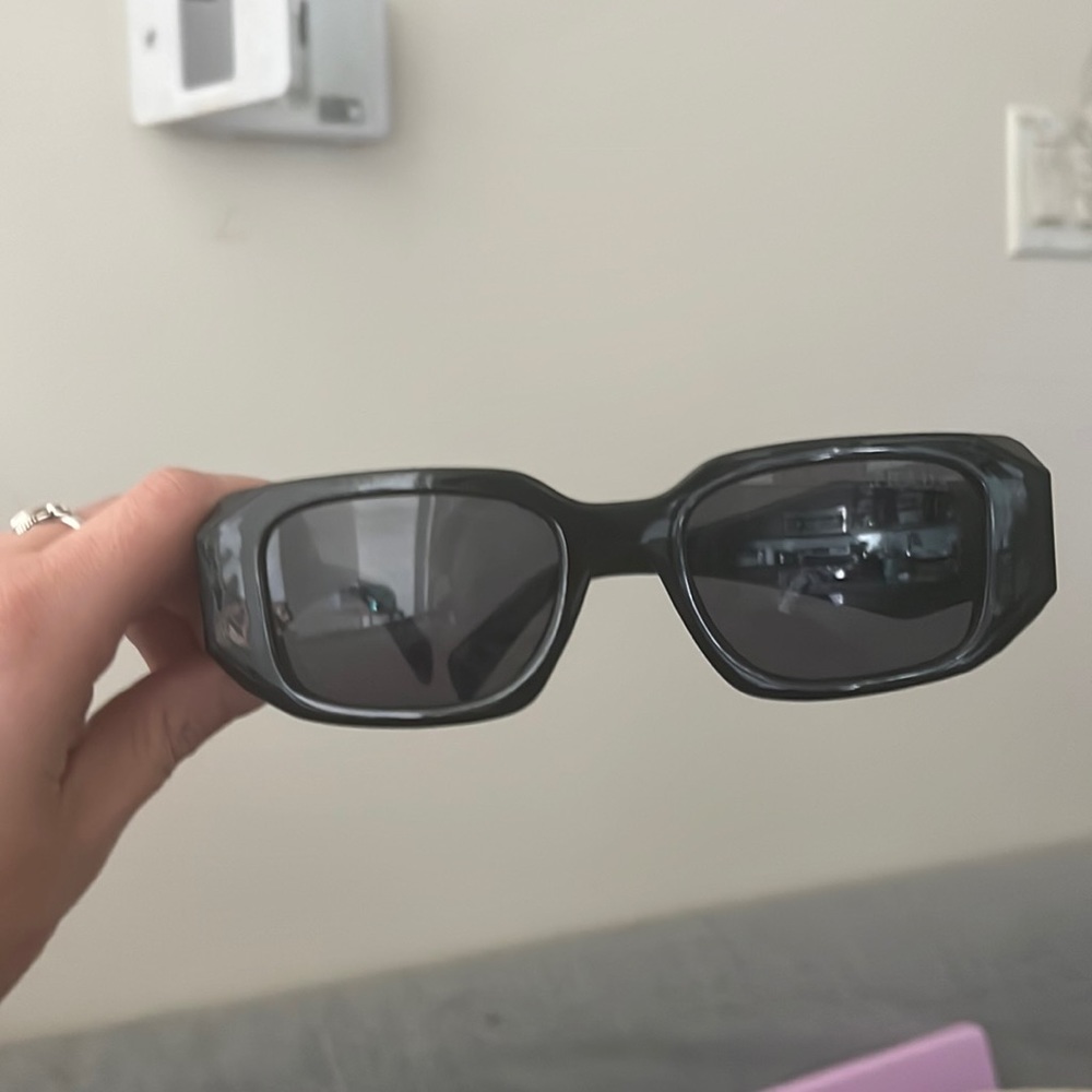 Prada sunglasses- gifted but are way to big for my face.